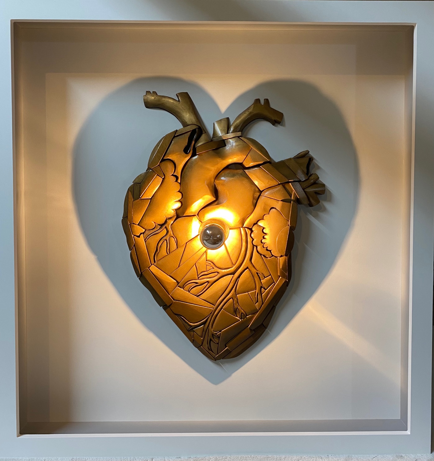 Dual-Image Silhouette in sculpted wood with gold patina