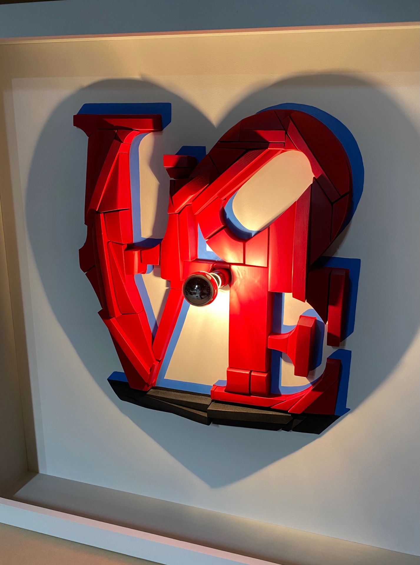Dual-Image Silhouette with blue accent, homage to Robert Indiana