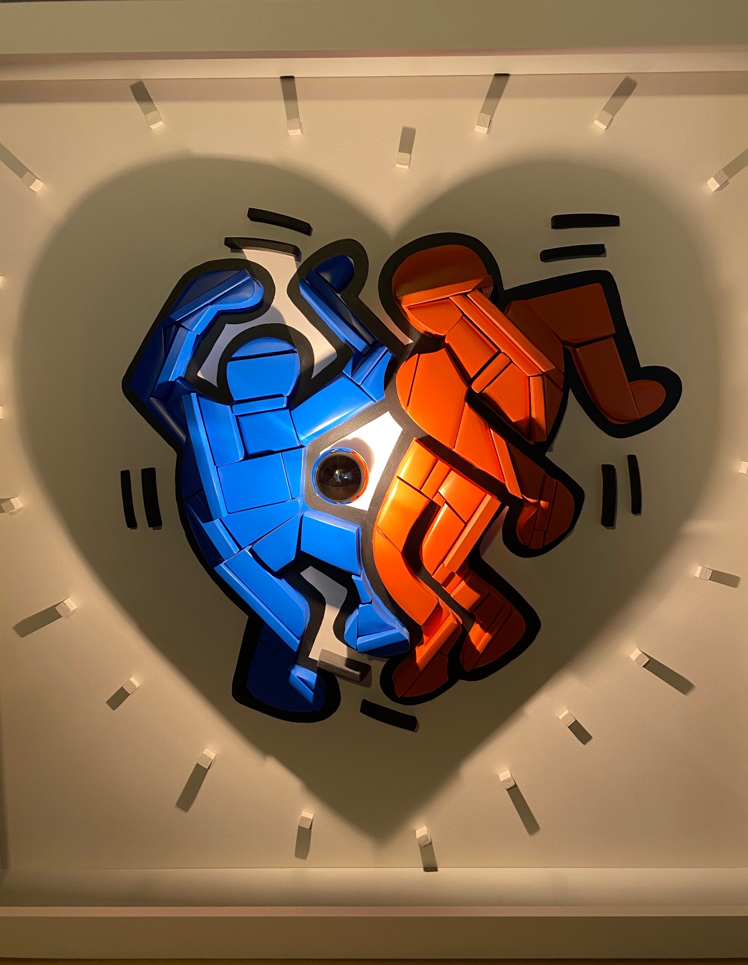 Dual-Image Silhouette with blue and red accents, homage to Keith Haring